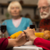 Elderly people around dinning table